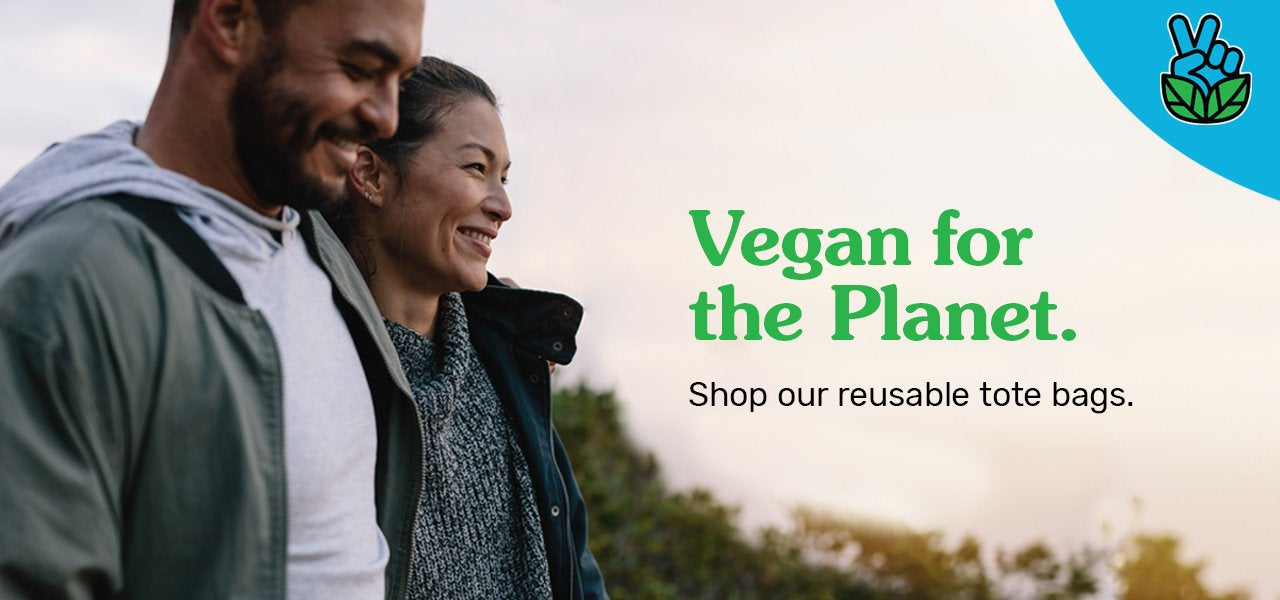 Photograph of a young, happy couple outside looking towards the setting sun. The image says, "Vegan for the Planet: Shop our reusable totes."
